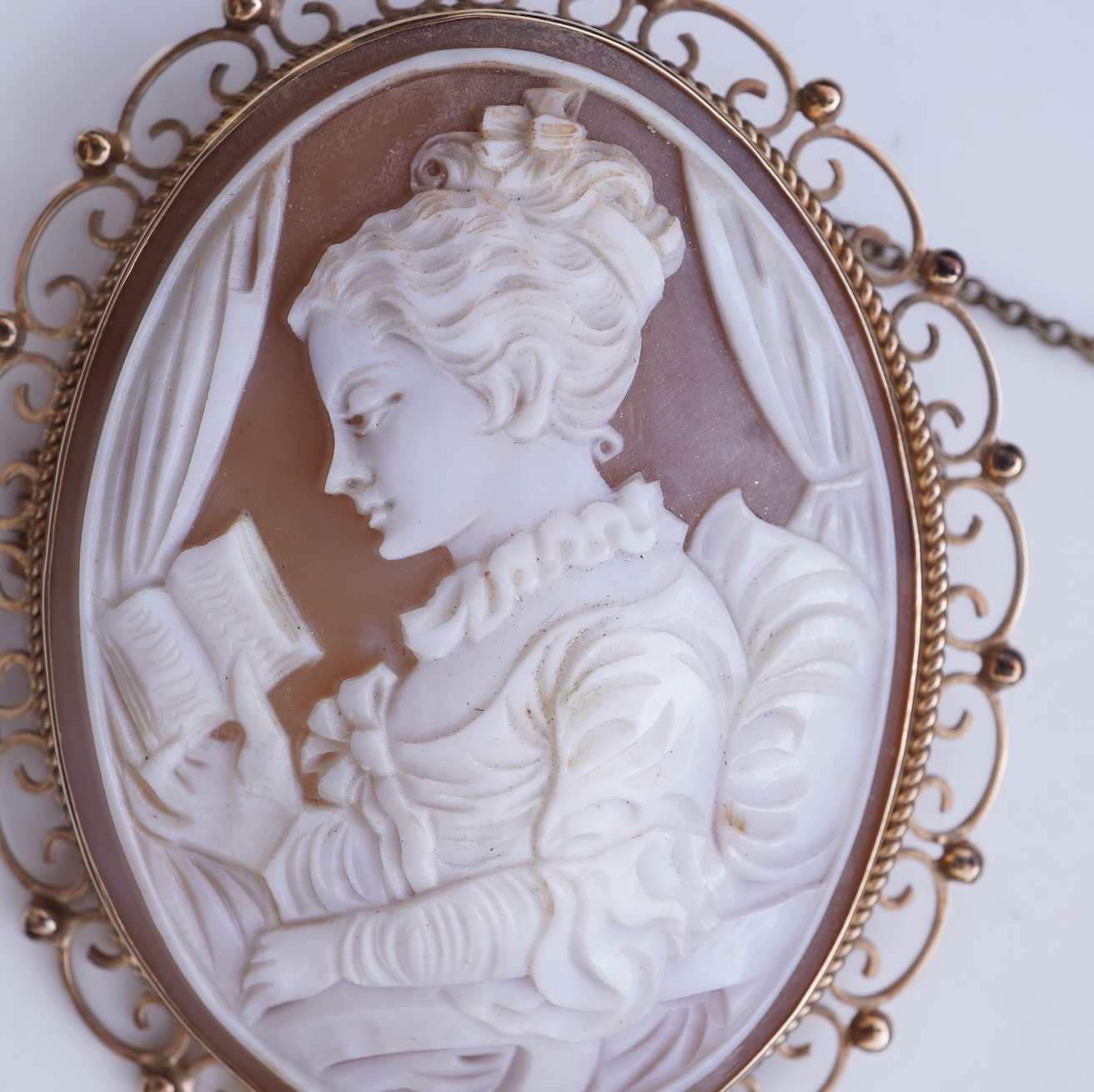 A shell cameo brooch and a gold and cultured pearl brooch